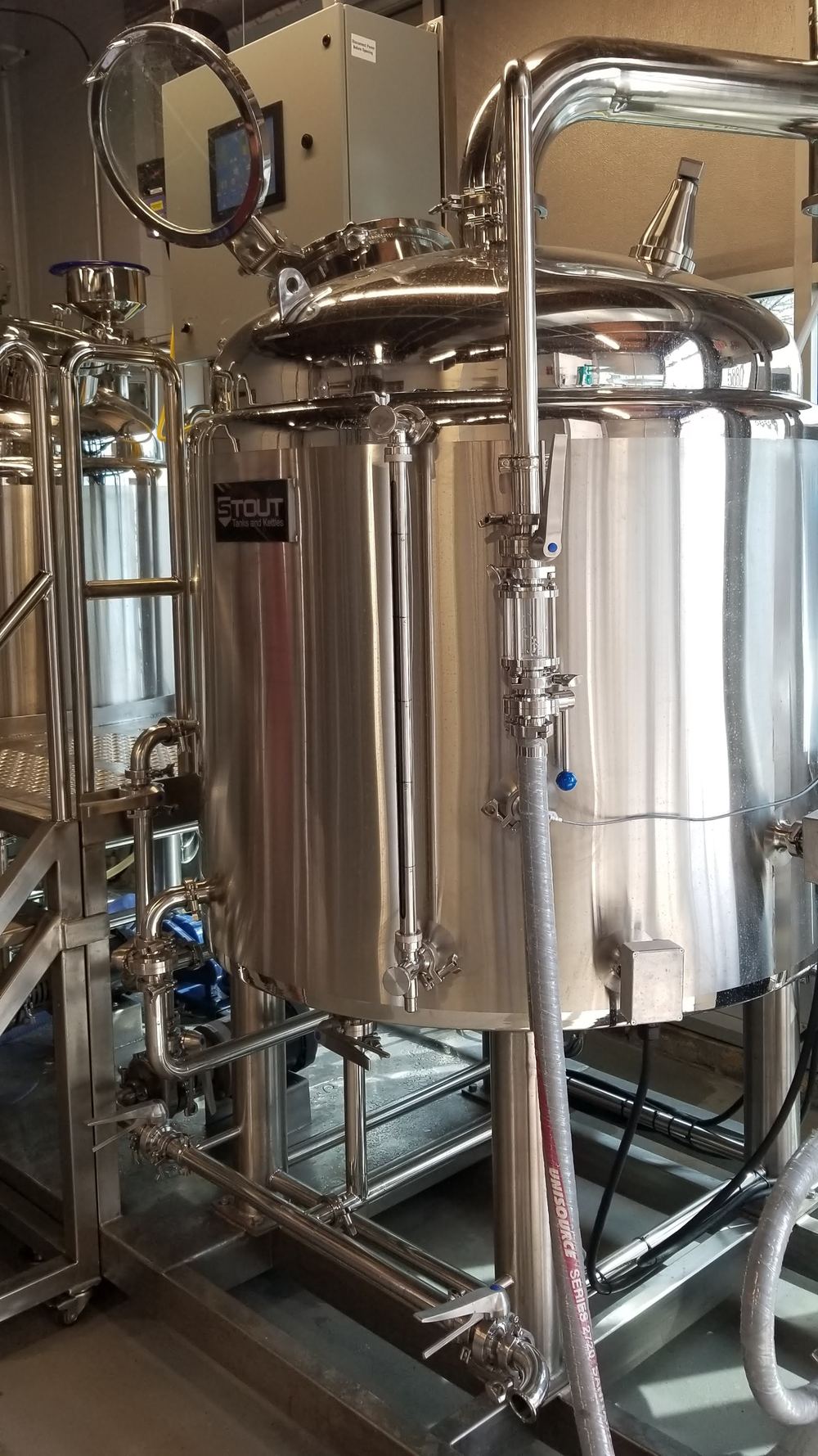 Stainless brewing tanks in a brewery