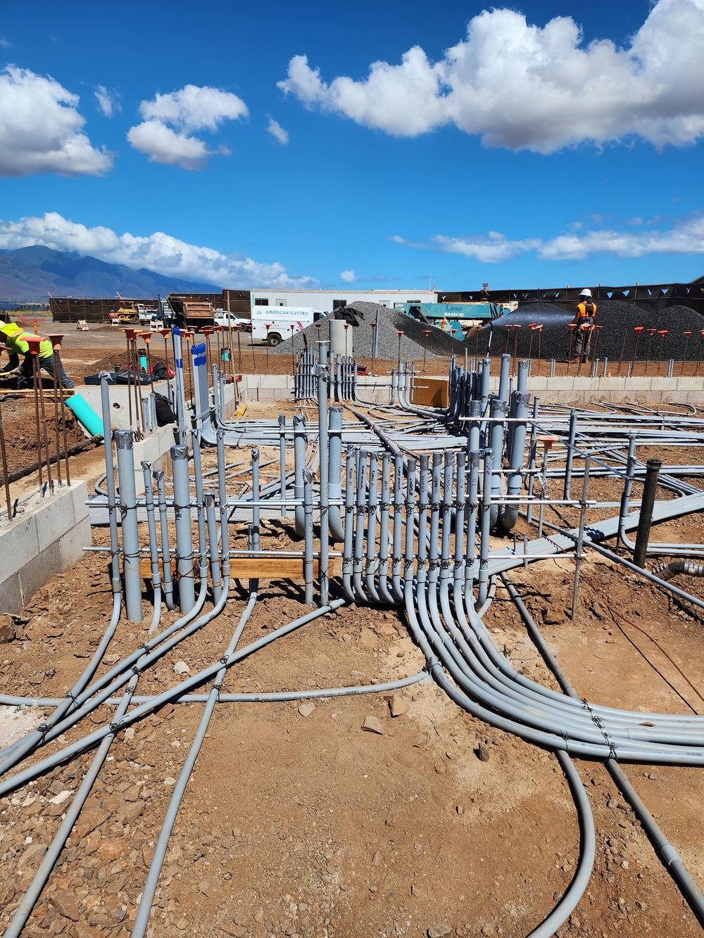 Conduit stub-ups across a graded site