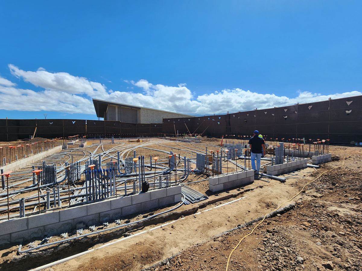 Large site under construction with underground utilities in place